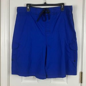 Liquid Wave blue swim trunks size large. Pockets on both legs, elastic waistband
